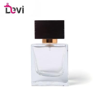 China Animated Devi Glass Perfume Bottles 30ML Adjust Men's Perfume Bottle With Brown Wood Cap Empty Container Sprayer Perfume Atomizer for sale