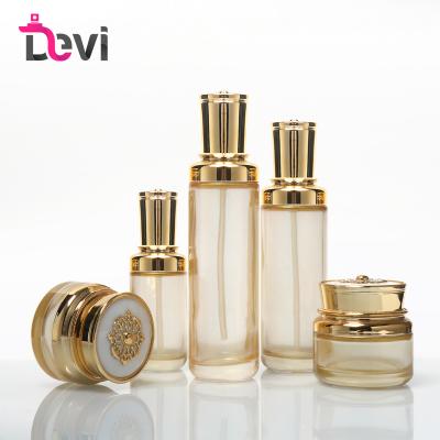 China Personal Care Devi Cosmetic Bottle Set Packaging 30g 50g 30ml 100ml 120ml Spray Bottle Ribbon Cream Glass Jar With Lip for sale