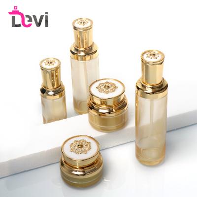 China Personal Care Devi Glass Gold Luxury Cosmetic Skin Care Bottle Packaging Set Jars For Lotion Face Cream 50g Empty 30ml 100ml 120ml for sale