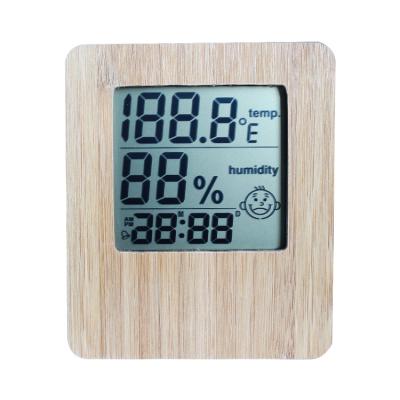 China Indoor Thermometers Digital Temperature Humidity Display Smiley Face Weather Forecast Alarm Bamboo Material Electronic Clock for sale