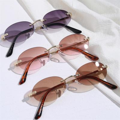 China Popular New Arrivals Vintage Sunglasses Fashion Sunglasses UV400 Rimless Oval Metal Frame Small Retro Glasses for sale