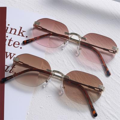 China Popular Metal Eyewear New Arrivals Fashion Sunglasses Small Frame Rimless Women Frameless Gradient Sunglasses Men for sale