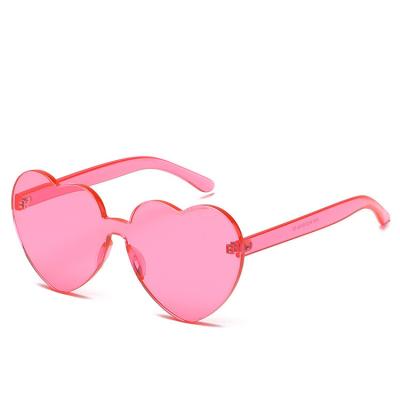 China Fashion Sunglasses OEM Heart Shape Colored Sunglasses Fashion Ladies Frameless Jelly Candy Color Thick One-Piece Sunglass Eyewear for sale