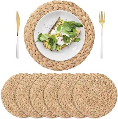 China Viable Handmade Rattan Placemats Wedding Table Mat Dinner Plate Kitchen Natural Dining Table Teacup Charger Elegant Place Mat for sale