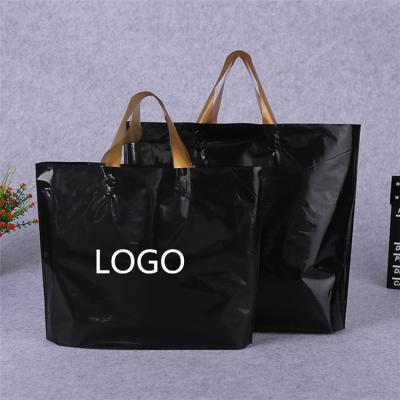 China Promotion Moisture Proof Gift Clear Black Plastic Packaging Bags With Company Logo Design Handles for sale