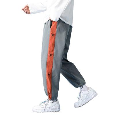 China Latest Custom Designs Anti-Wrinkle Mens White Splice Trekking Track Cargo Work Pants Casual Anorak Pants For Men for sale