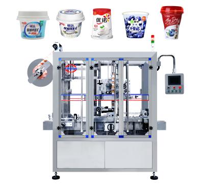 China Hot Sale Food XINHUA Cup Labeling Machine Label Shrink Wrap Machine For PP Cup PS Cup Yogurt for sale