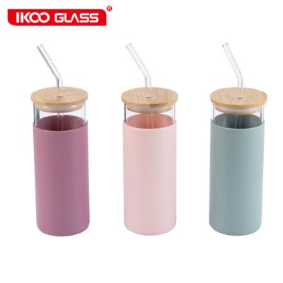 China Modern Design Colored Stocked Borosilicate Glass Tumbler With Wooden Lid And Silicone Protective Sleeve for sale