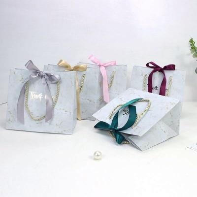 China Recycled Materials Shape Marble Cute Thank You Printed Luxury Paper Bag With Ribbon White Panel Custom Paper Gift Packaging Bag for sale