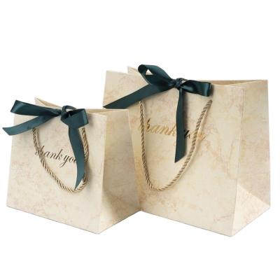 China Recycled Materials New Arrival Recycle Yellow Marble Thank You Luxury Paper Bag With Ribbon Wrapping Paper Gift Bag And Box for sale