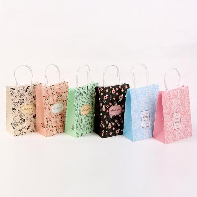 China Recycled Materials Flower Luxury Pink Kraft Paper Bag With Handle Customized Paper Packaging For Wedding Party Favor Dressing Paper Bags for sale