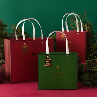 China High Quality Snowflake Logo Custom Shopping Paper Bag Christmas Gift Wrapping Paper Bag Aseptic Green Red for sale