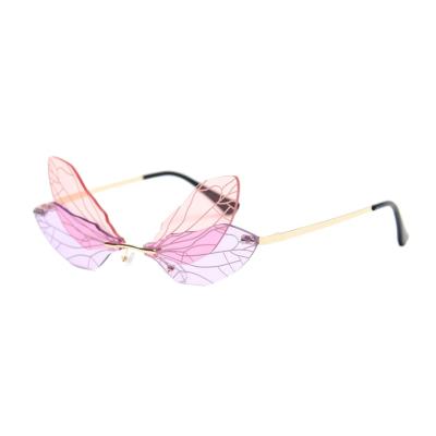 China 2021 Fashionable Rimless Wholesale Women Rimless Shade Sun Glass Change Color Dragonfly Wings Sunglasses for sale