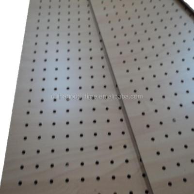 China Moisture Proof Melamine Faced Wood Solid Color Perforated Hardboard MDF With Holes for sale