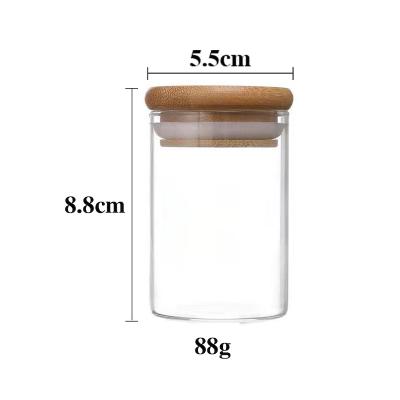 China Wholesale Custom Microwavable Glass Jar Stash 100ml Bamboo Lid 4 Sizes For Storage Tobacco And Spice for sale