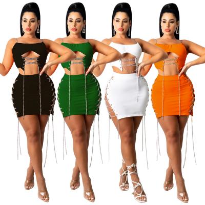 China New Arrival Anti-Static Sling Skirt Top One Line Nightclub Set Hollow Two Pieces Women Set With Chain for sale