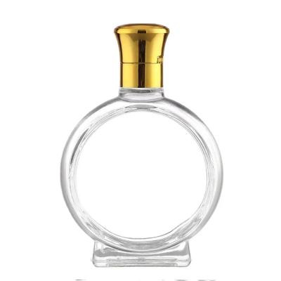 China 100ml Eco-friendly Recyclable Round Shape Glass Perfume Bottle Wine Liquor Glass Bottles for sale