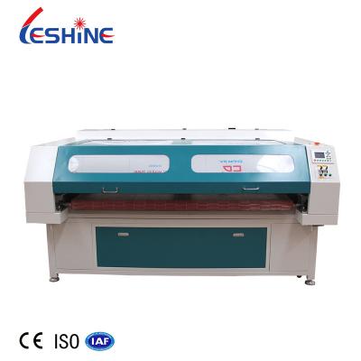 China Auto Feeding Laser Cutter Tubo Laser CO2 80w Reci Fabric Eextile Label Upholster Laser Cutting Machine for sale