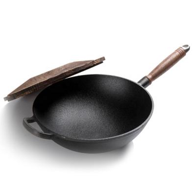 China Sustainable Stron Cookware Maker Stick Wok Pan Thai Cookware Non Set Cast Iron Wok Pan with Wooden Handle for sale