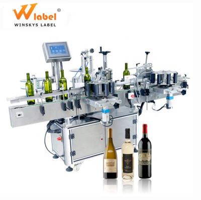 China Automatic Products PLC Control High Precision Wine Round Bottle Positioning Adhesive Labeling Machine for sale