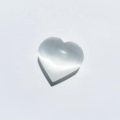 China Europe Natural Carved Puffy Selenite Heart Crystal Satin Spar Heart Crafts Natural Polished Palm Stone Pocket Stone Chakra Healing for sale