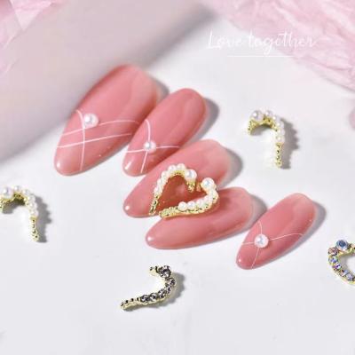 China 2022 Creative Half Heart Design Half Heart Shape Coalescent Rhinestone Left/Right NR058 Jewelry Heat Nail Metal Rhinestone Nail Rhinestone for sale