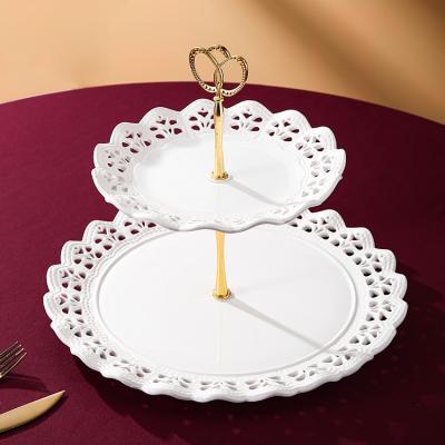 China Wedding Party Decor Double Layer Stocked Dessert Dishes Round Cake Stand 2 Tier Ceramic Cake Dish With Gold Handle for sale