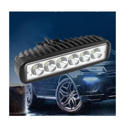 China Long Spotlight 18W Plastic Car 12v LED Strip Auxiliary Work Light 24v Led Working Car Motorcycle Light Headlight for sale