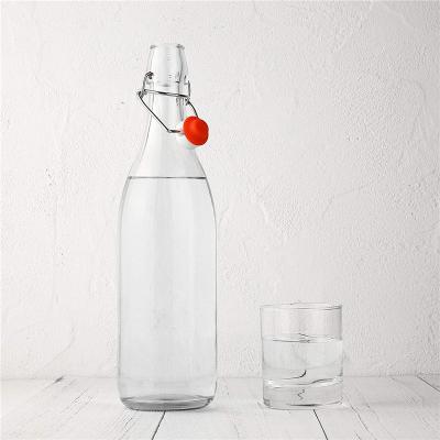 China Stocked Hot Selling Clear Glass Wine Bottle Swing Top Bottle For Kombucha Drinks for sale