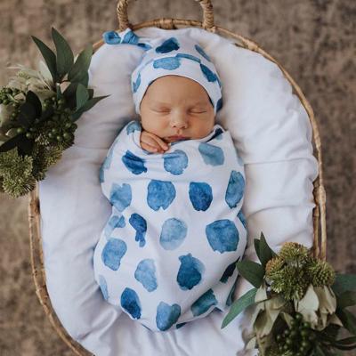 China Breathable Photography Prop Cotton Newborn Baby Wrap Infant Sling Sleep Sack With Matching Headband for sale