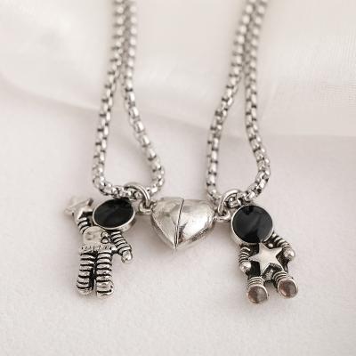 China Romantic Minimalist 2Pcs Lovers Matching Friendship Astronaut Couple Magnetic Pendant Necklace Jewelry Anniversary Gift for sale