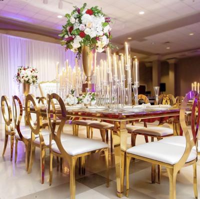 China Modern Luxury Gold Stainless Steel Stackable Wedding Event Chairs for sale