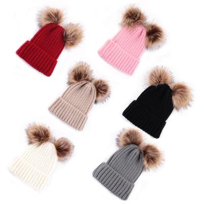 China Popular JOINT Winter Knit Hat Faux Fur Pom Pom Beanies Warmly Line Balls Knitted Hat For Women for sale