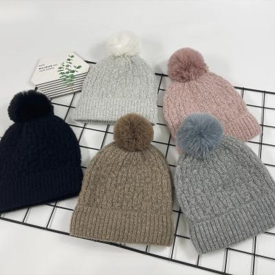 China Wholesale COMMON Faux Fur Knit Pom Pom Beanies Winter Warmly Pompom Knitted Hat Women Unisex for sale