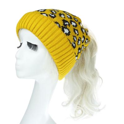 China JOINT Wholesale New Supply Winter Ladies Beanie Hats Leopard Winter Ponytail Acrylic Knitted Hats With Hole for sale