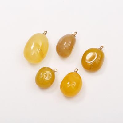 China Factory direct sales vintage colored pebble red stone charming yellow stone jade pendant earrings accessories for sale