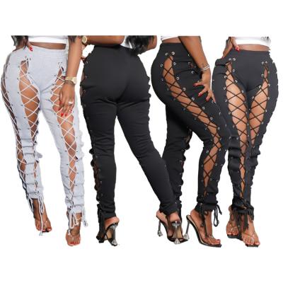 China New Fashion Bandage Sweatpants Women's Breathable Pants Hollow Out Long Pants Women Club Wear Dresses for sale