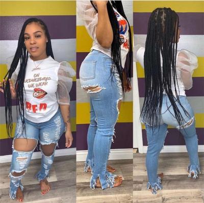 China 2021 Fashion Breathable Soft Floral Holes And Small Tassel Women Jeans Pants Distressed Ripped Jeans for sale