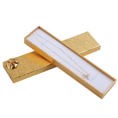 China Packaging Items Customize Logo Necklace Gift Box Wholesale Gold Paper Cardboard Jewelry Packaging Box With Gold Bow for sale