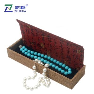 China Recyclable Custom Canvas Jewelry Box Classic Long Tassel High Grade Jewelry Packaging for sale