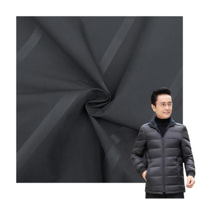 China Waterproof heat seal down jacket fabric winter fabric laminate clothing for banowal man for sale