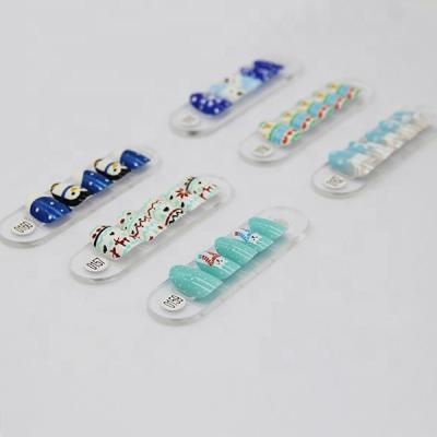 China OEM Blue Shorts Art Design Winter Design Oval Artificial Nail Tips for sale