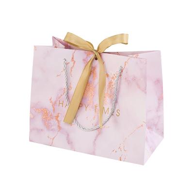 China Recyclable Wholesale Recyclable Paper Wedding Favor Handbag Recycle Materials Shopping Custom Paper Bags White Marble Gift Bag for sale