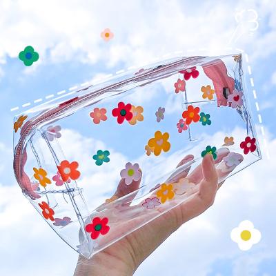 China Beautiful Portable Large Capacity Gift Transparent Cosmetic Bag 2021 New Pen Bag Wash Storage for sale