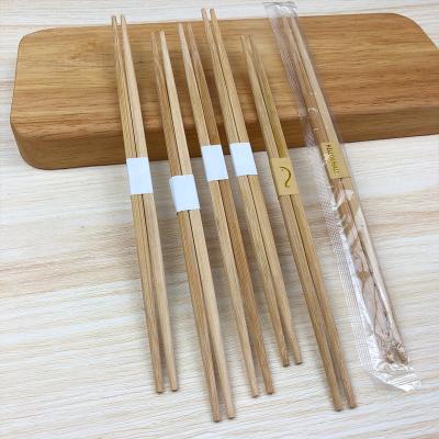 China Disposable 50 Pair Double Tip Disposable Carbonized Chopsticks Custom Printed Disposable Sushi Set Chopsticks Bamboo Personalized Chopst à venda