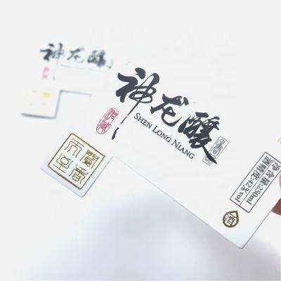 China Durable Printing And Gold Foil Stamping Logo White PU Leatherette Patches Labels for sale