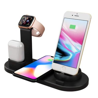 China Mobile Phones Earphone Wireless Charger Four In One Vertical Qi Wireless Charger For Mobile Phone Earphones Watches Smart Chargers for sale