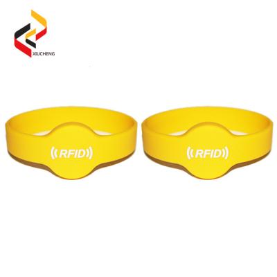 China Watch type custom 13.56MHz chip RFID NFC silicone wristbands for swimming pool for sale