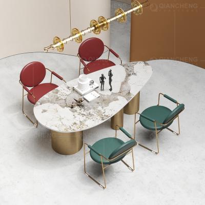 China Light Luxury Gold Marble Base Dining Table Stone Table Modern Clumped Oval Dining Table Long for sale