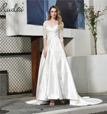 China Anti-wrinkle 32387 Ready To Ship Elegant Boat Neck Illusion Long Sleeve Appliques Sequins Satin Wedding Dresses For Bridal Gown Dress for sale